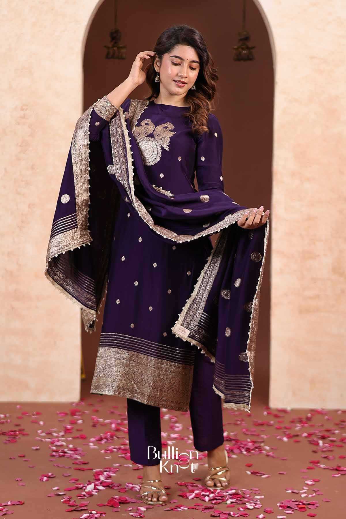 Close-up of model in purple kurta with gold polka dots and embroidered neckline, showcasing elegant ethnic style for celebrations