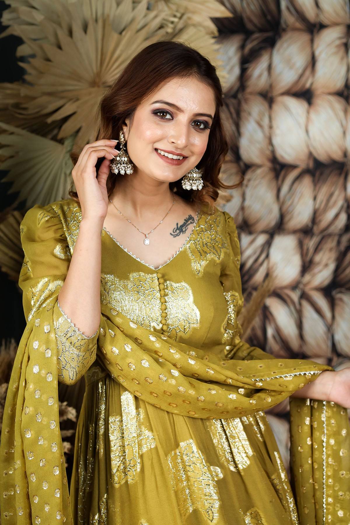 a woman in jeqcard Anarkali dress