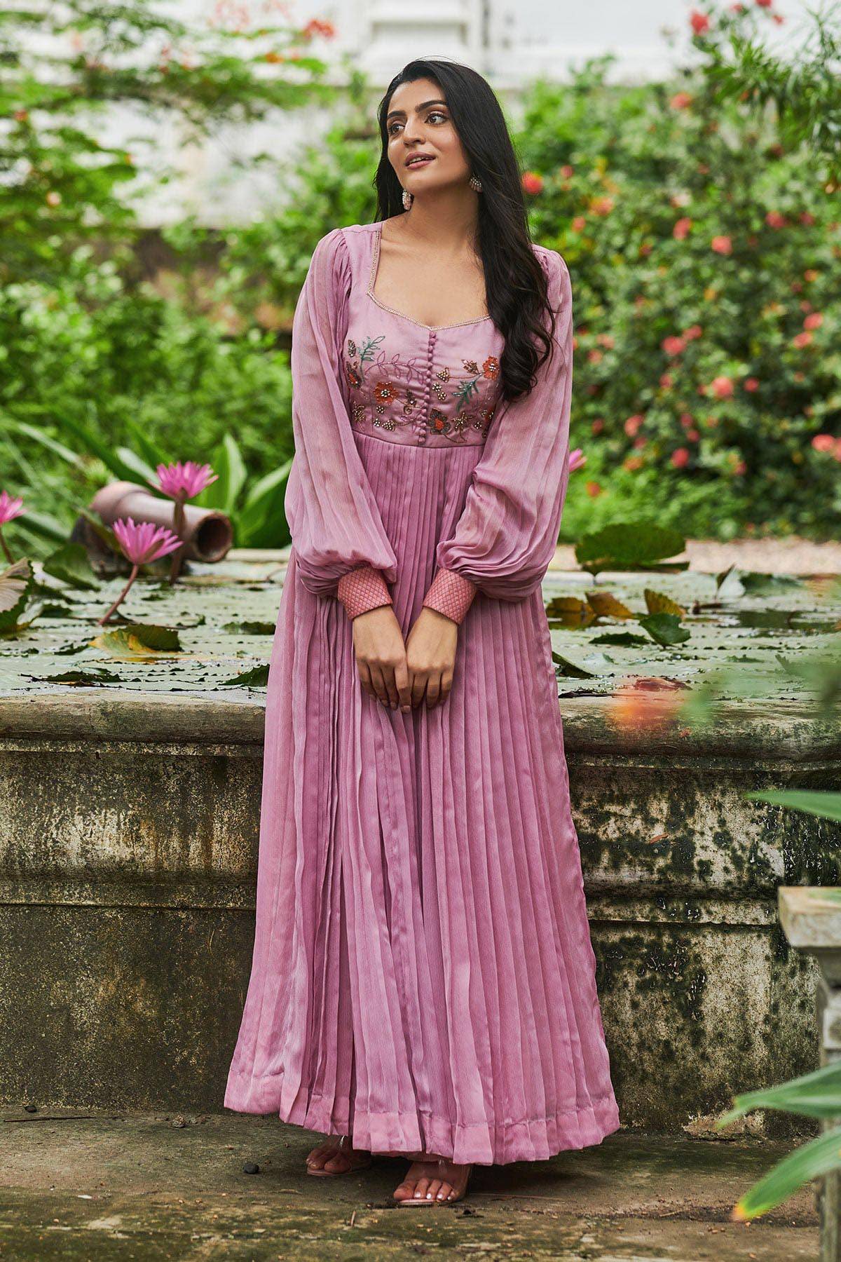 a woman in pink long dress