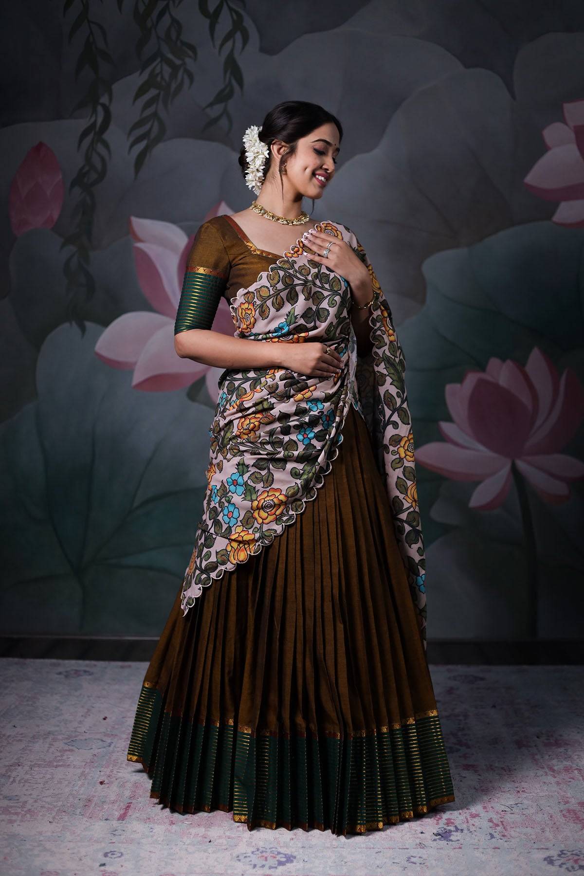 a woman in mehendi green handloom dress