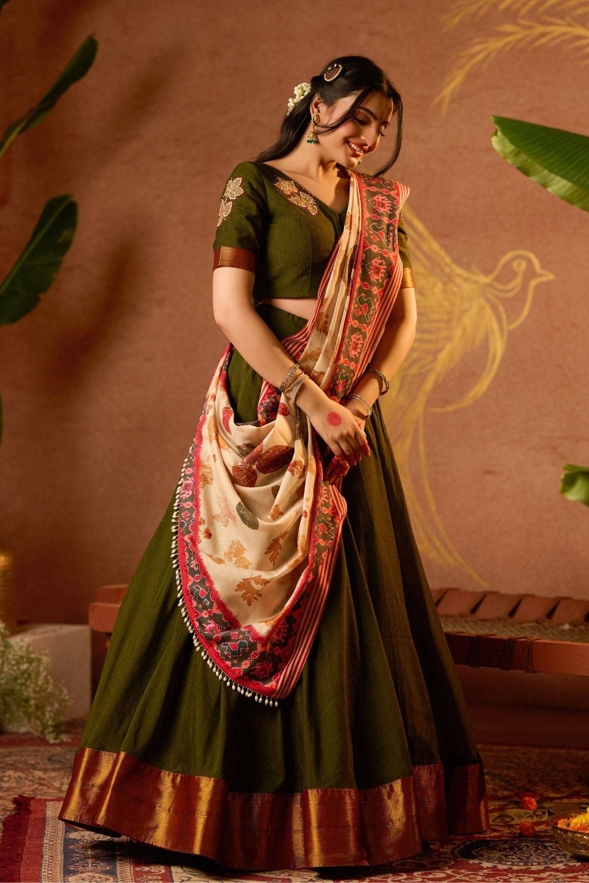 Tithi Lehenga Set in Mehendi at bullionknot featuring handloom texture and vibrant dupatta drape. A graceful pick for traditional attire lovers.