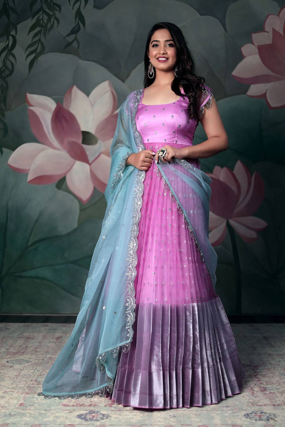 a women with pink organza Anarkali dress