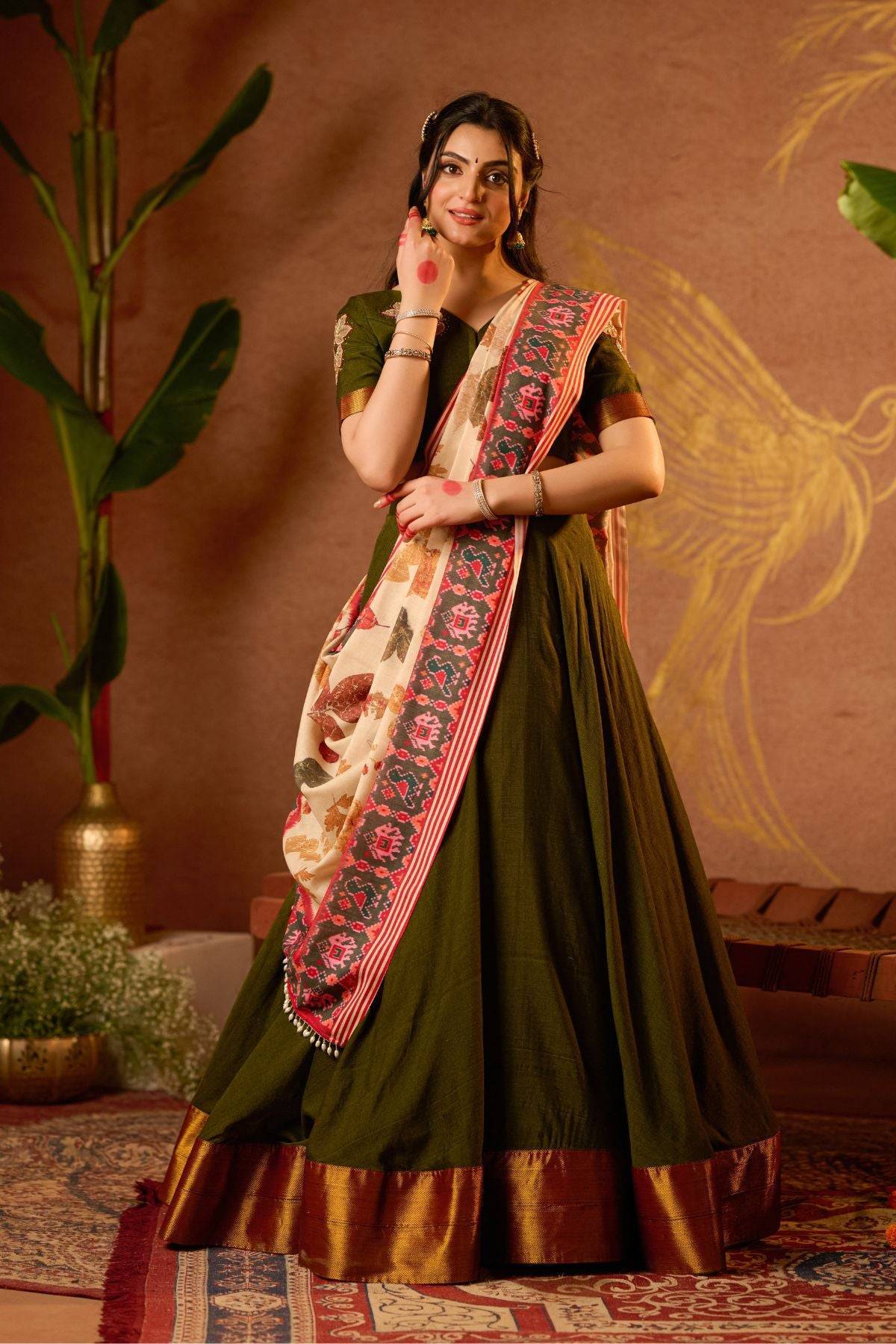 Exclusive Tithi Lehenga Set in Mehendi at bullionknot styled with floral embroidery and festive accessories. A standout in ceremonial clothing collections.