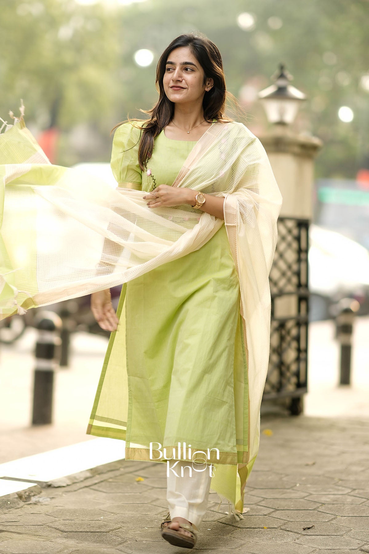 Woman in a light green Suit Set