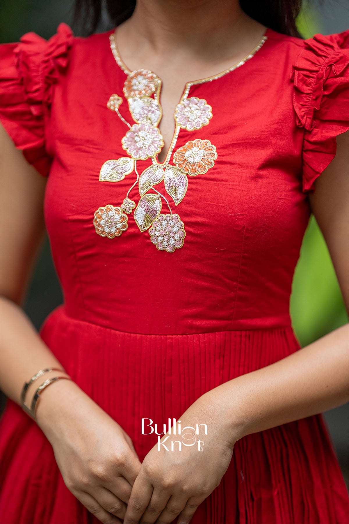 Close-up of Red Mul Cotton Midi Dress sleeves, soft cotton finish