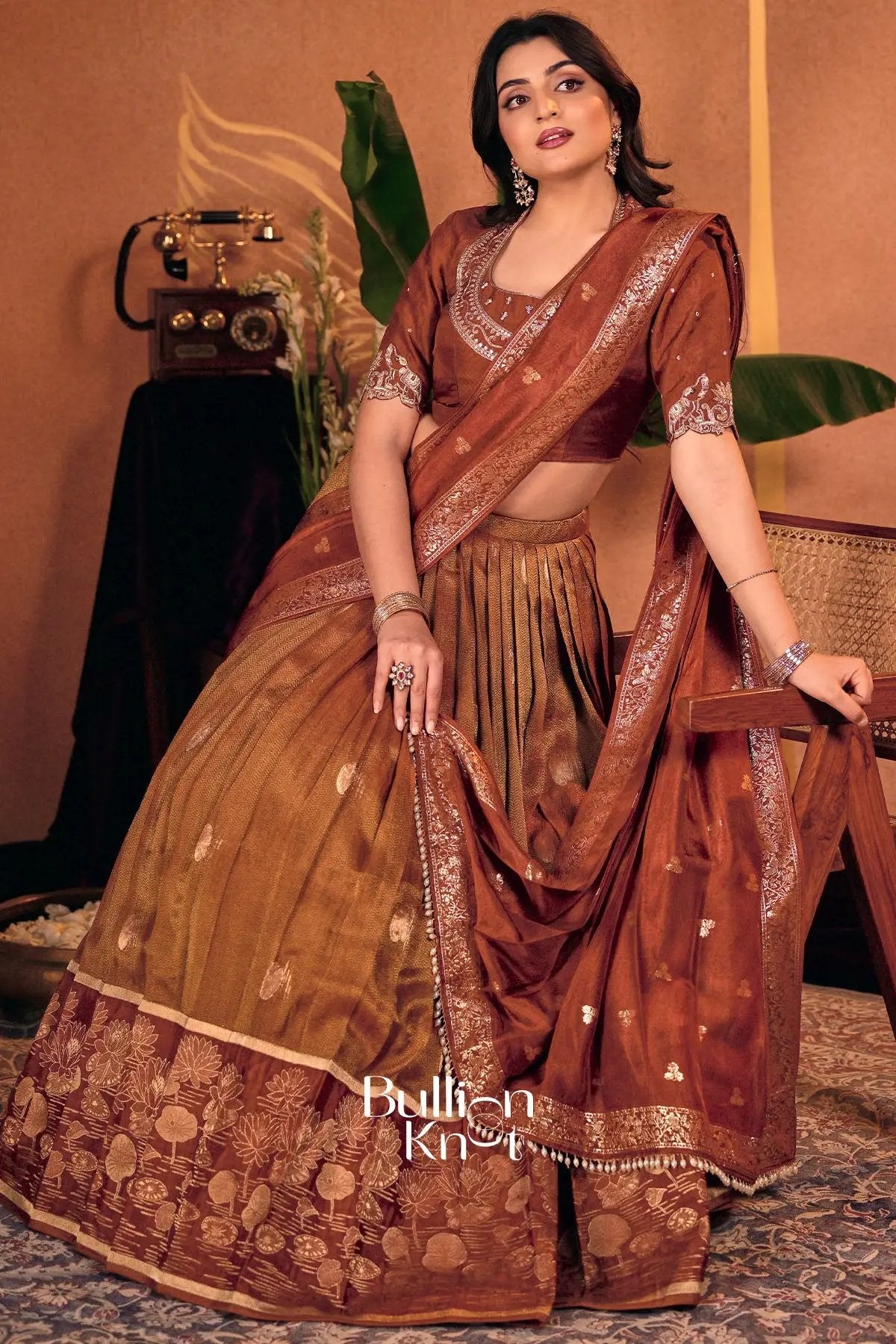 Rust silk lehenga set with intricate embroidery