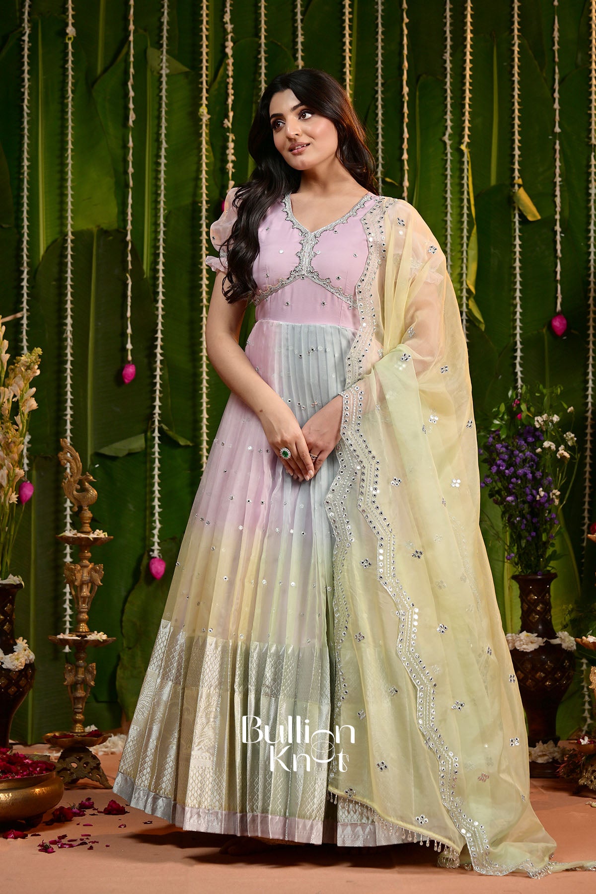 TV actress wearing pastel pink and yellow Kalpita Organza Pattu Gown, traditional and elegant ethnic dress for celebrations