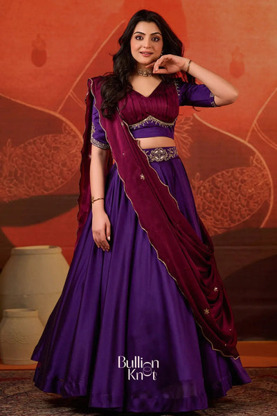Exclusive Lehenga - Ariana Charm Lehenga Set in Purple at bullionknot featuring a rich purple skirt, embroidered blouse, and maroon dupatta.