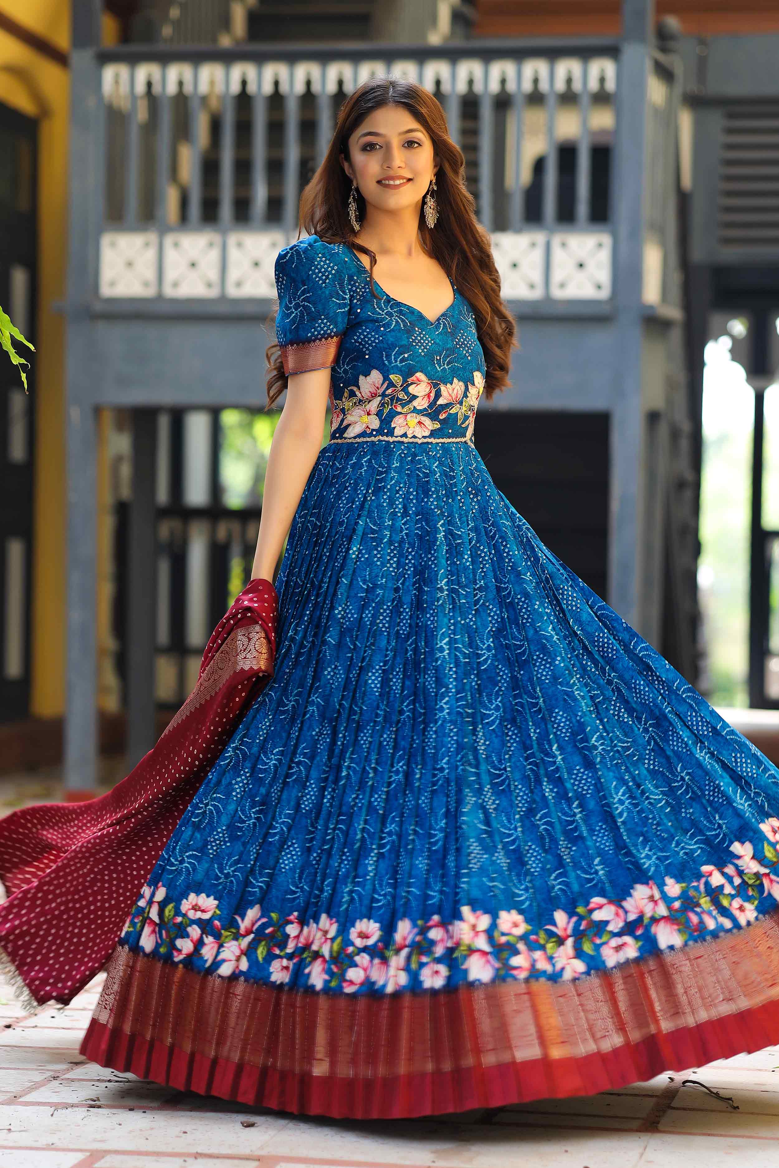 a woman in blue bandhej anarkali dress