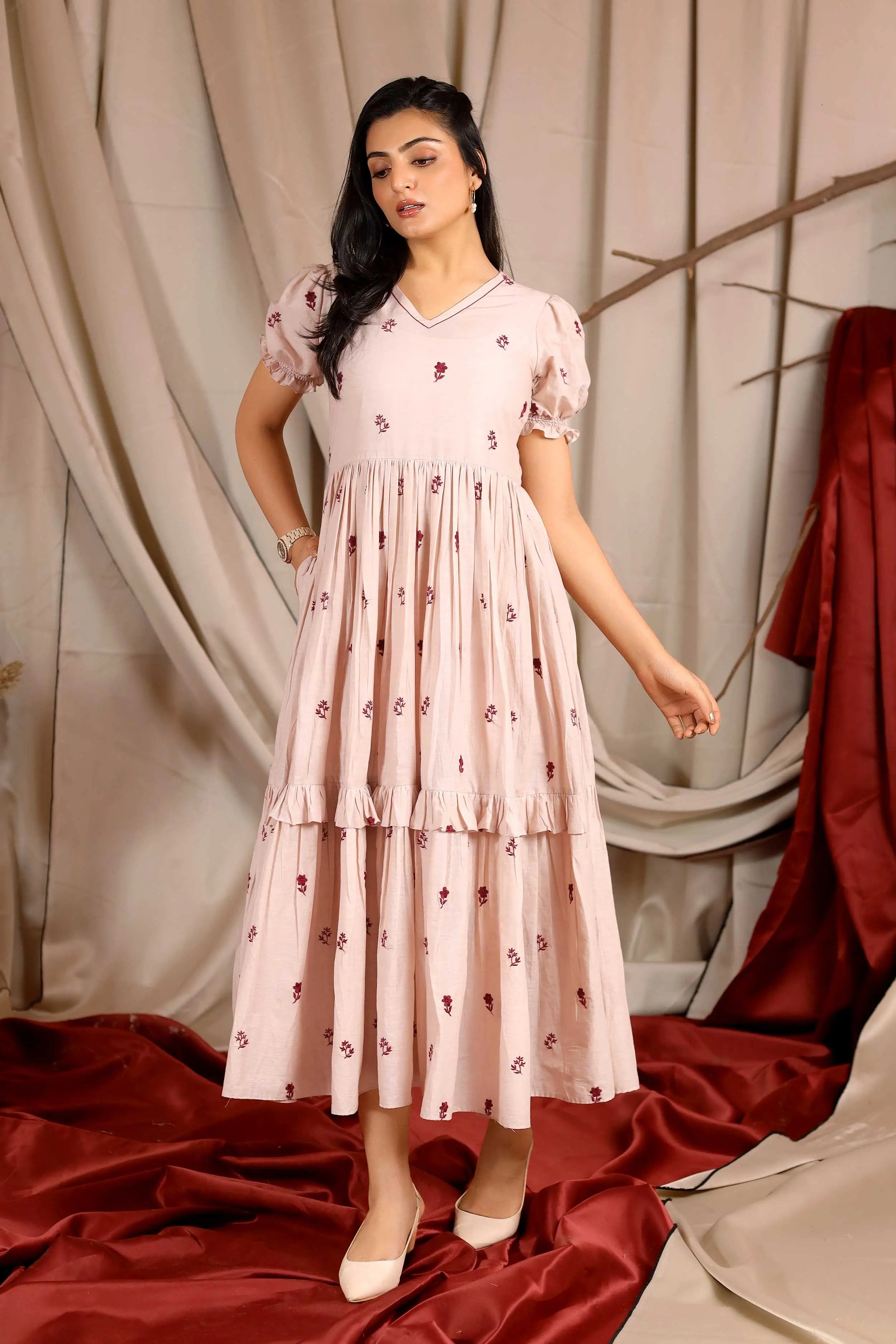 a woman in long dress - Bullionknot