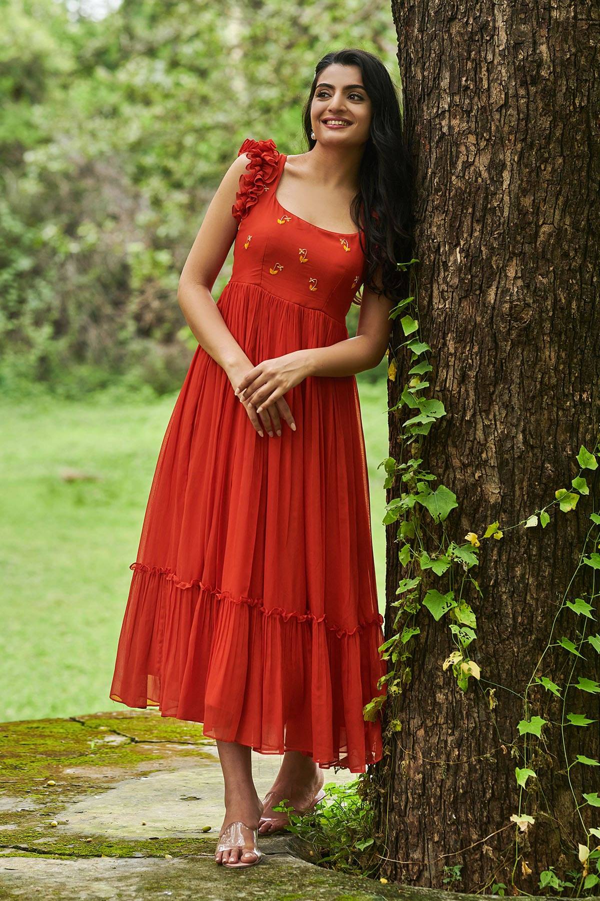 a model in carrot orange dress