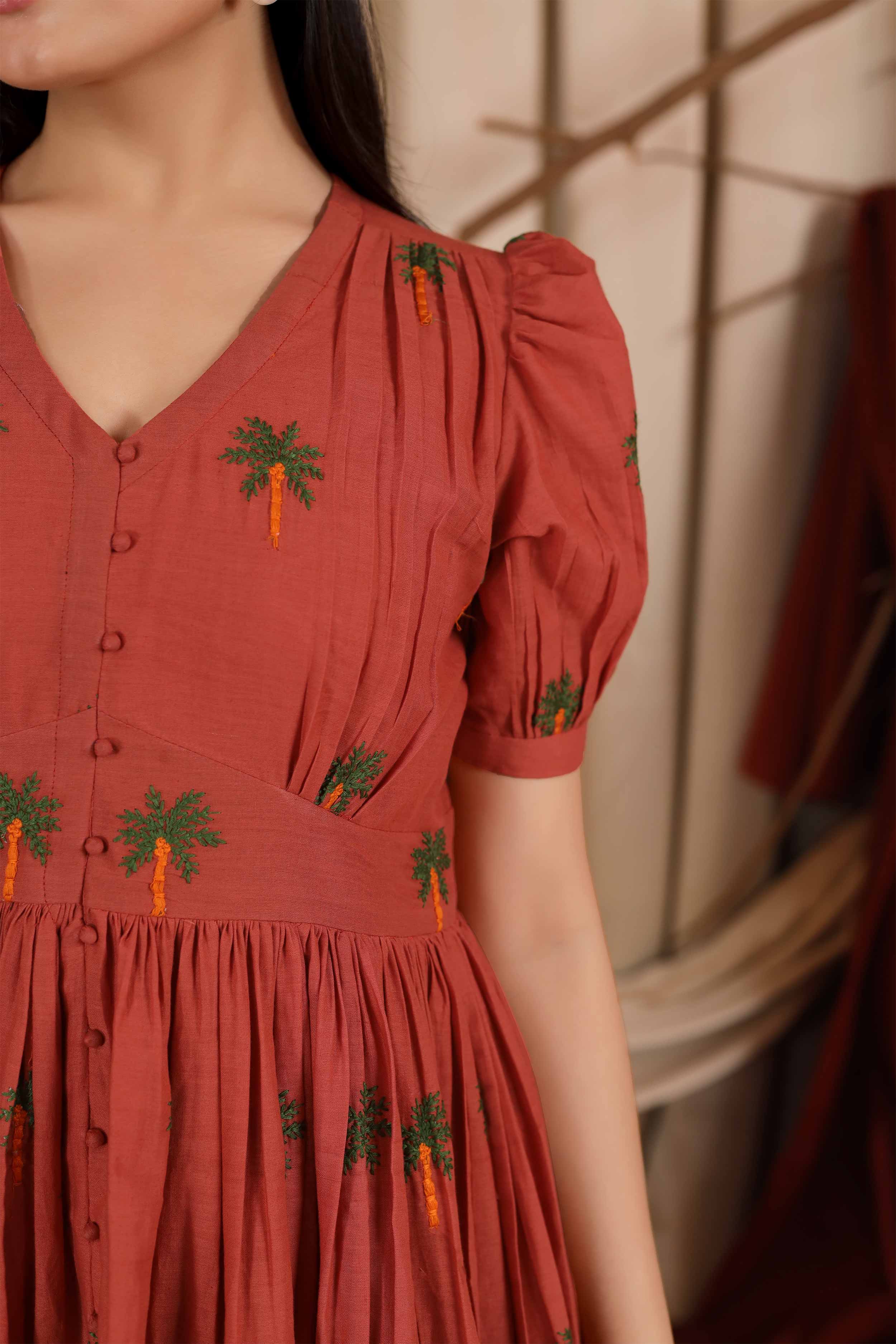 a woman in Emily Summer Dress in Sunrise Orange