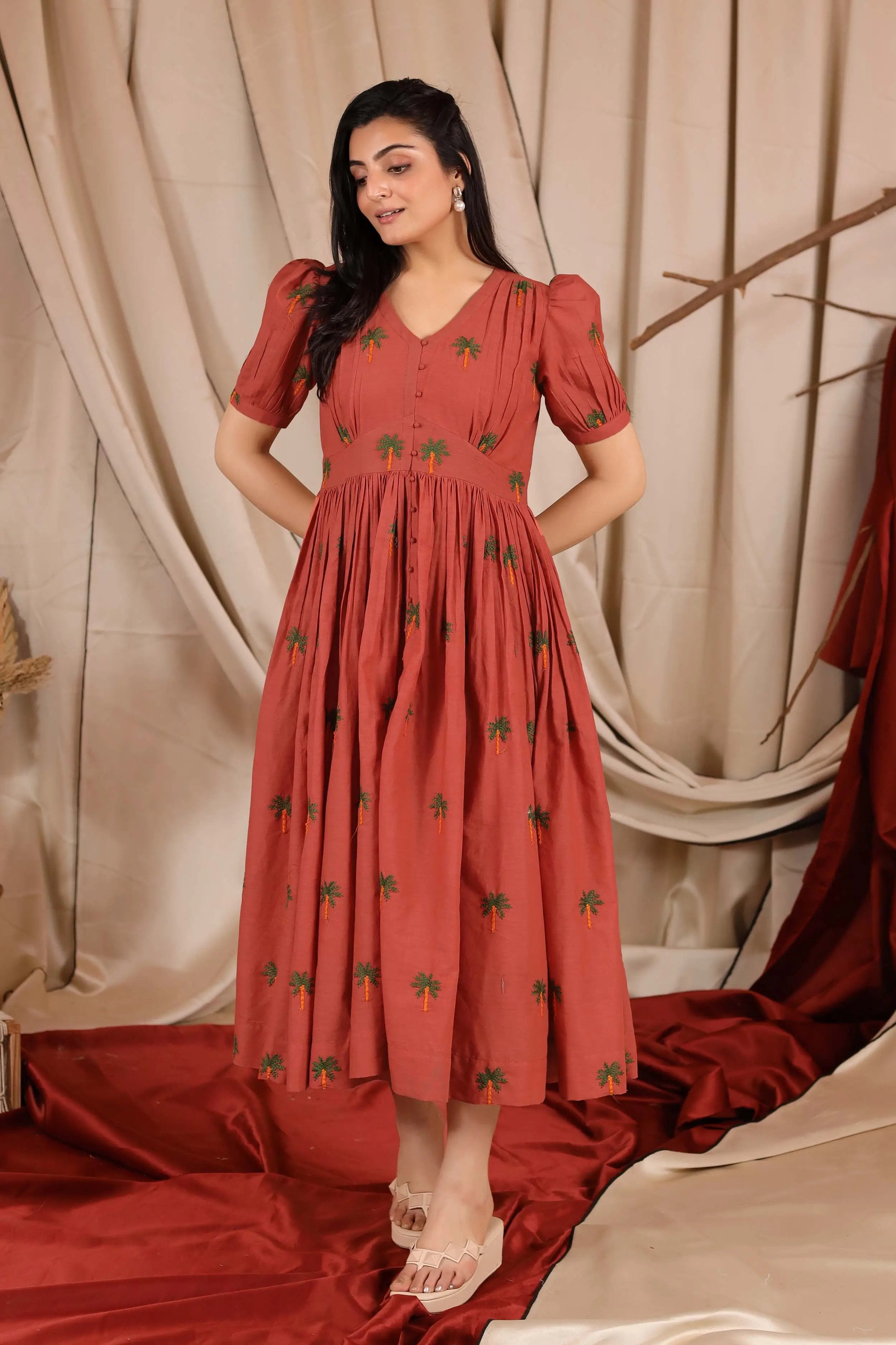 a woman in orange long dress
