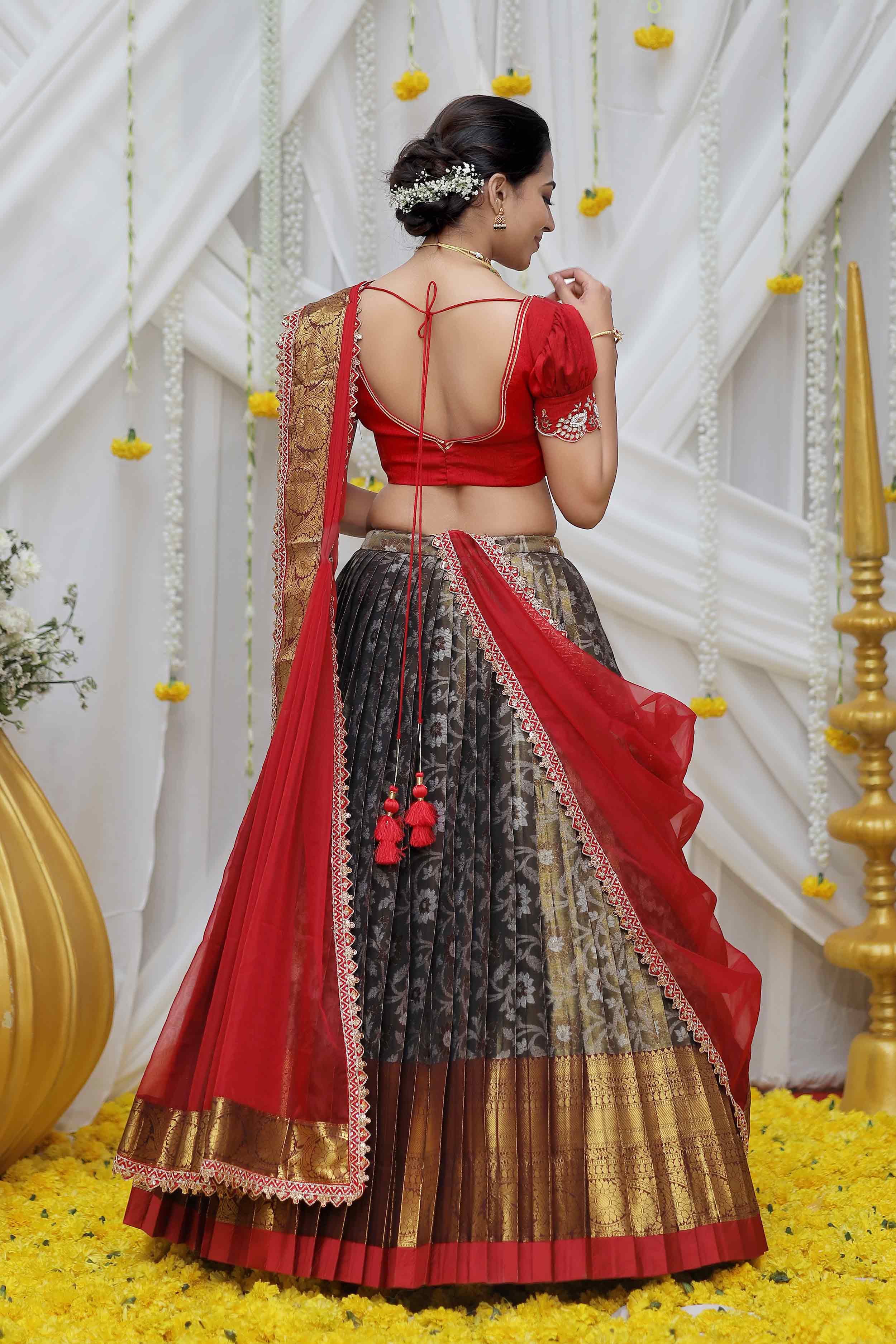 a woman in copper and maroon banarasi silk lahenga set