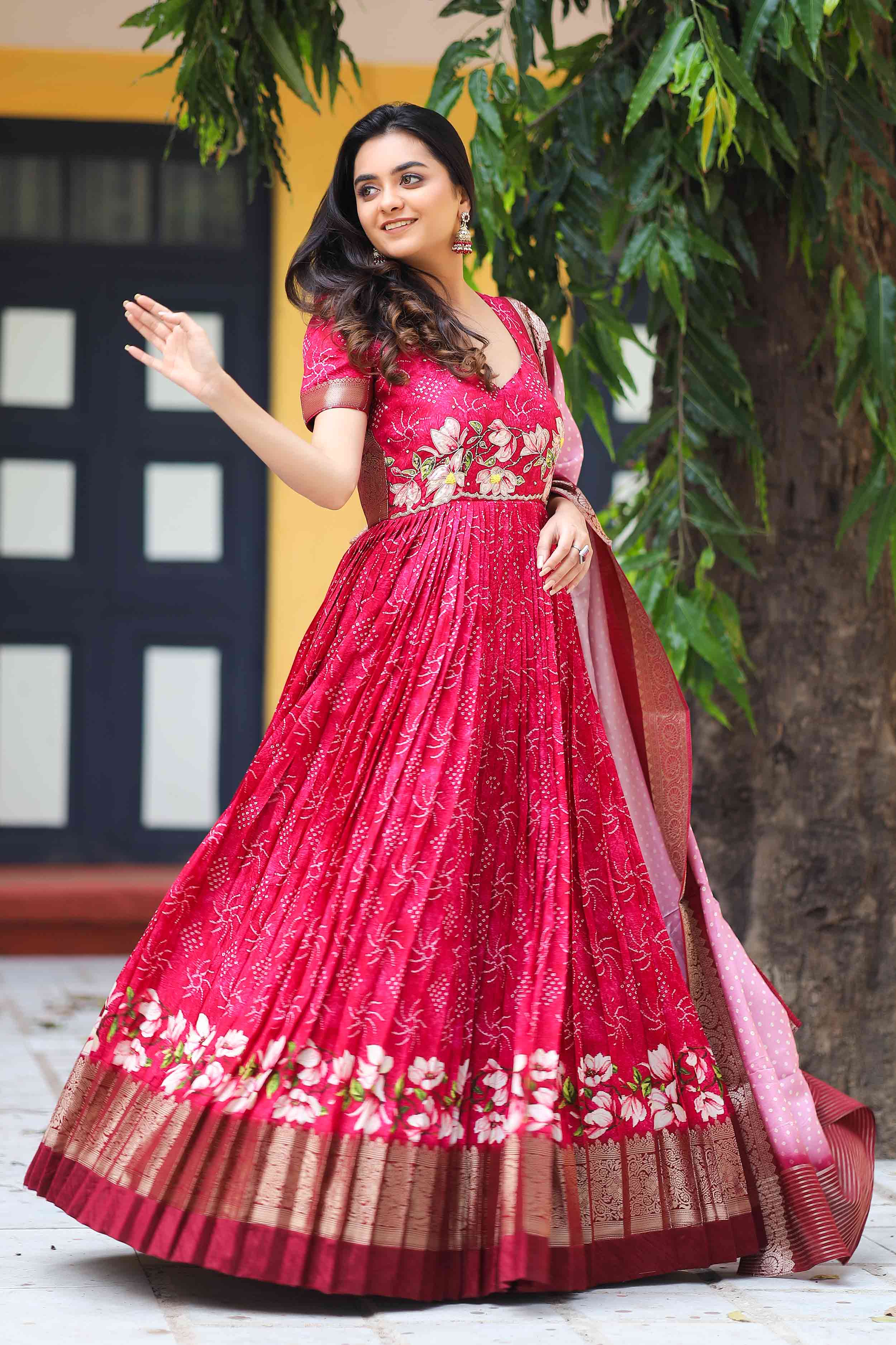 a woman in pink banarasi dress