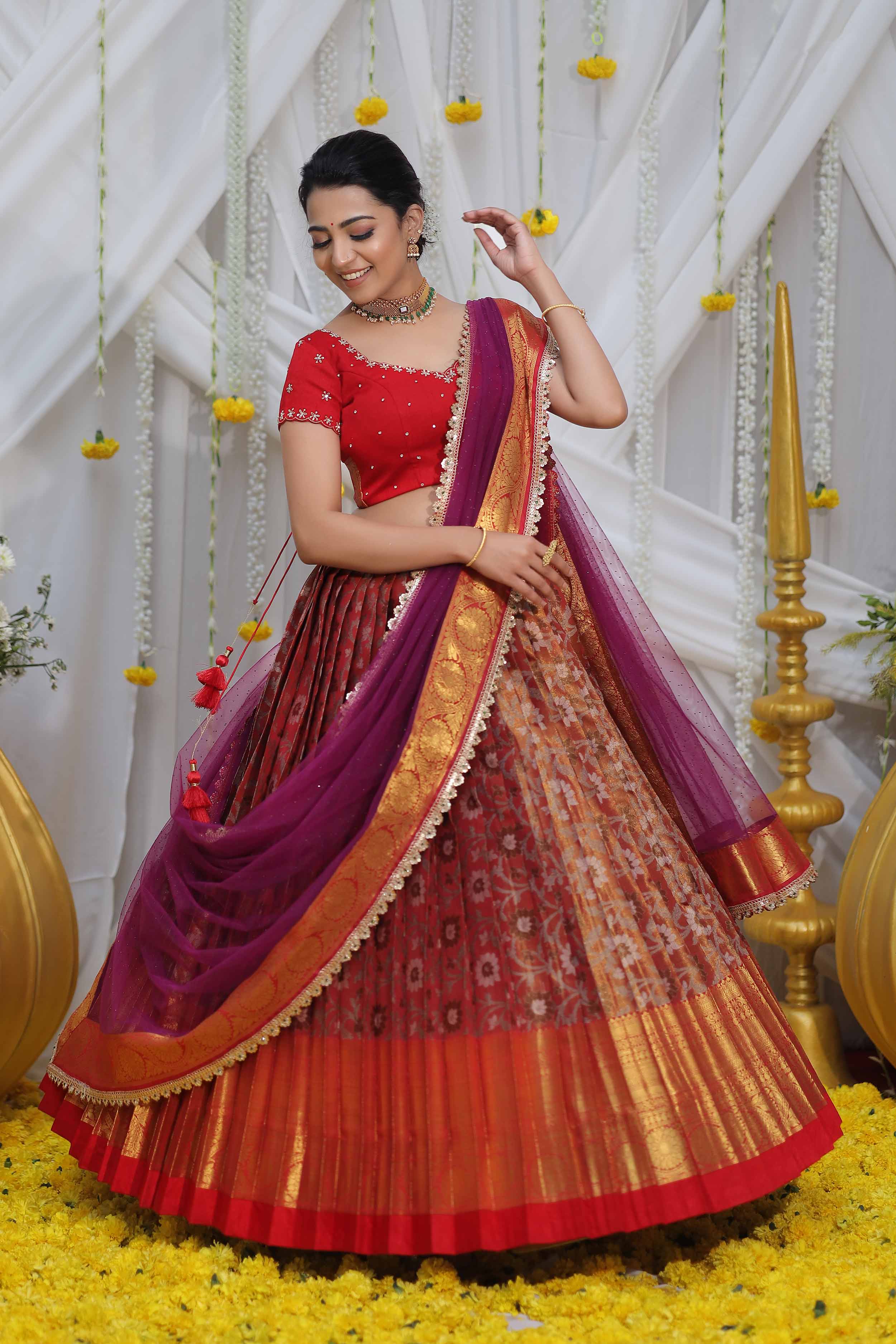 A woman in Red Lehenga suit