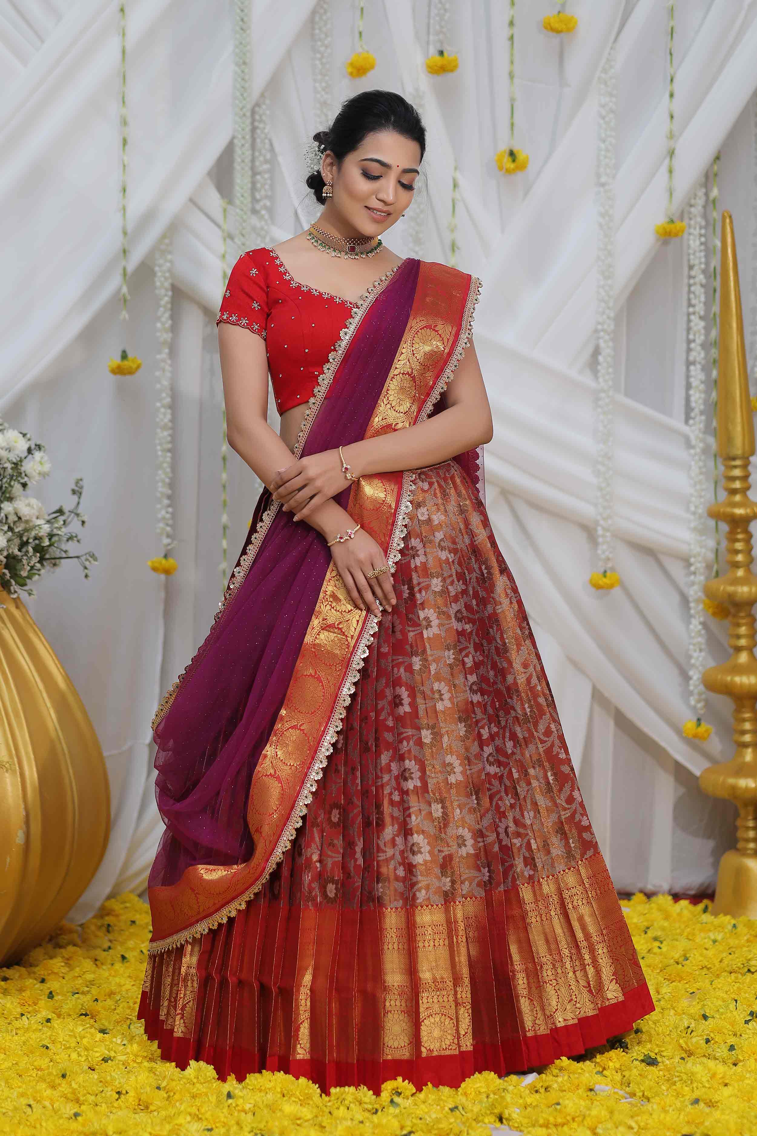 a woman in Red Half Saree