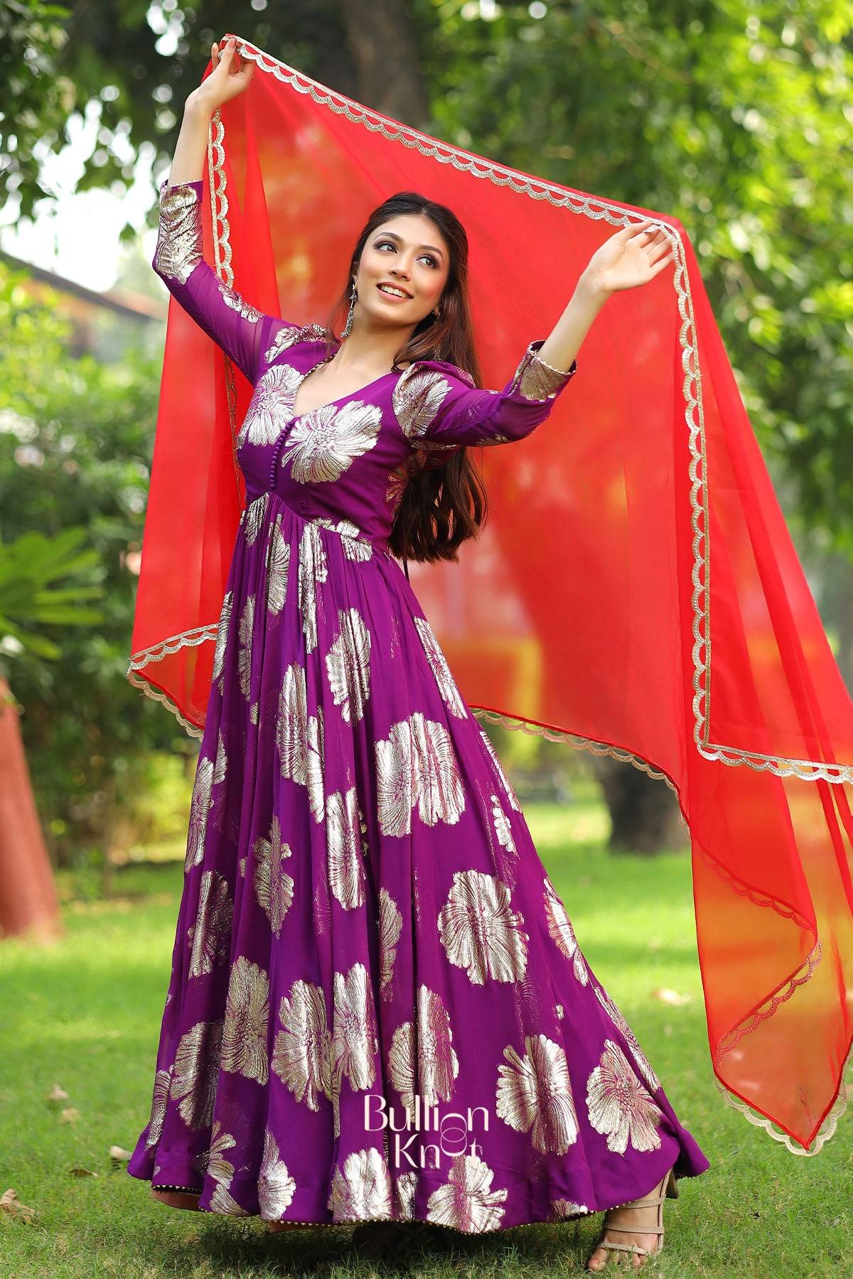 Woman in a purple dress with floral patterns 
