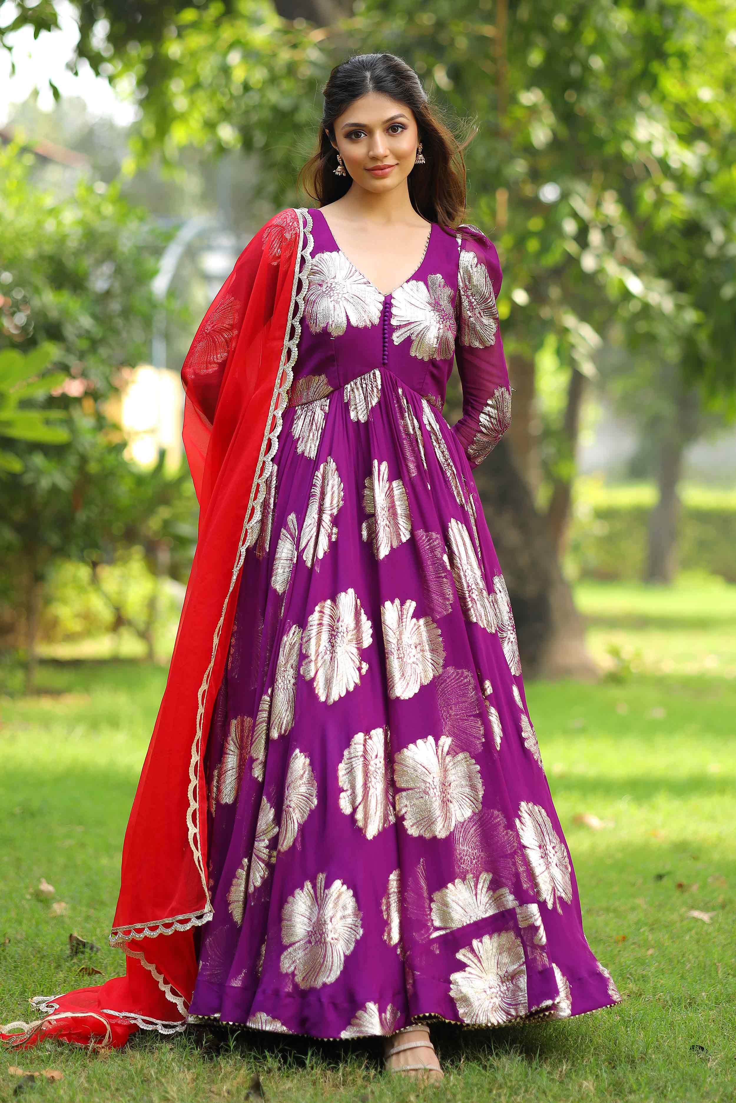 Model in purple Anarkali dress with intricate silver patterns