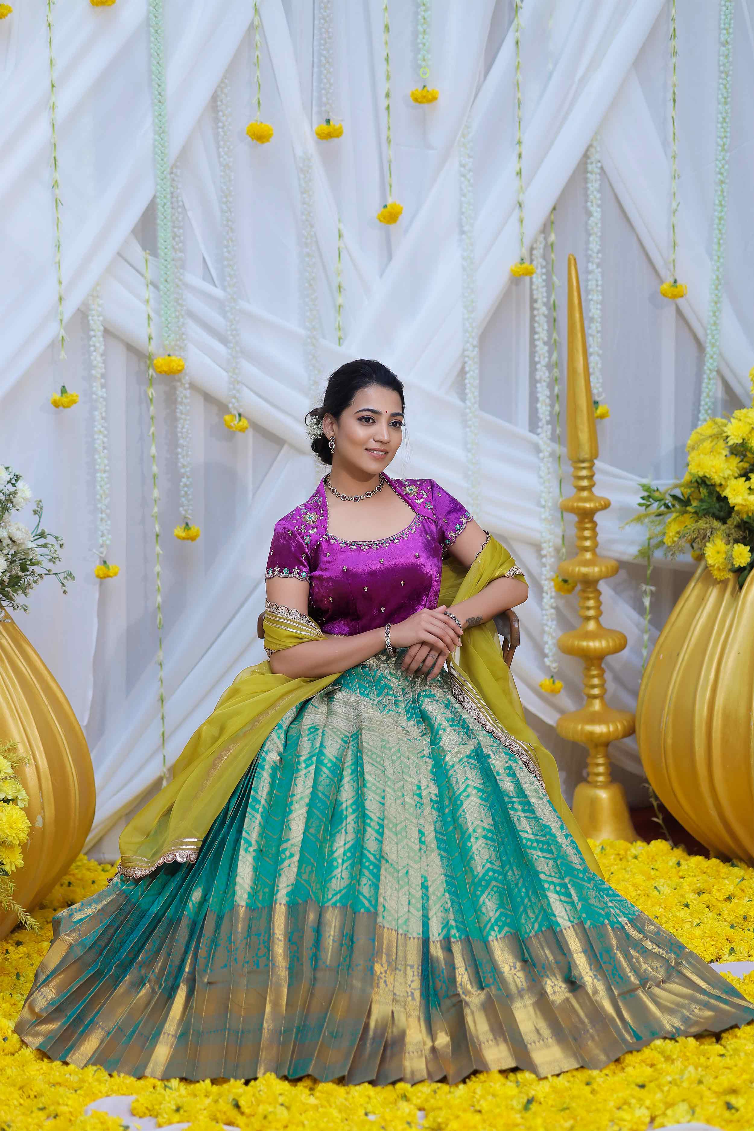 Seated pose in Kaveri Halfsaree Lehenga Set
