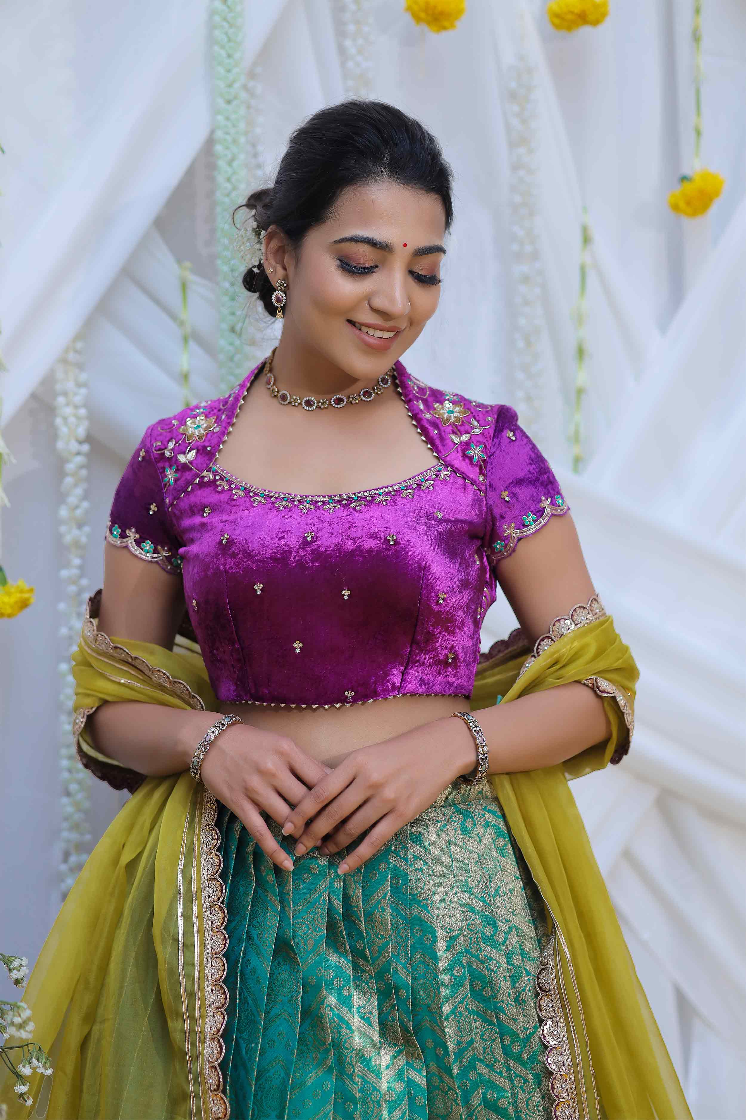 Elegant purple blouse with green lehenga skirt