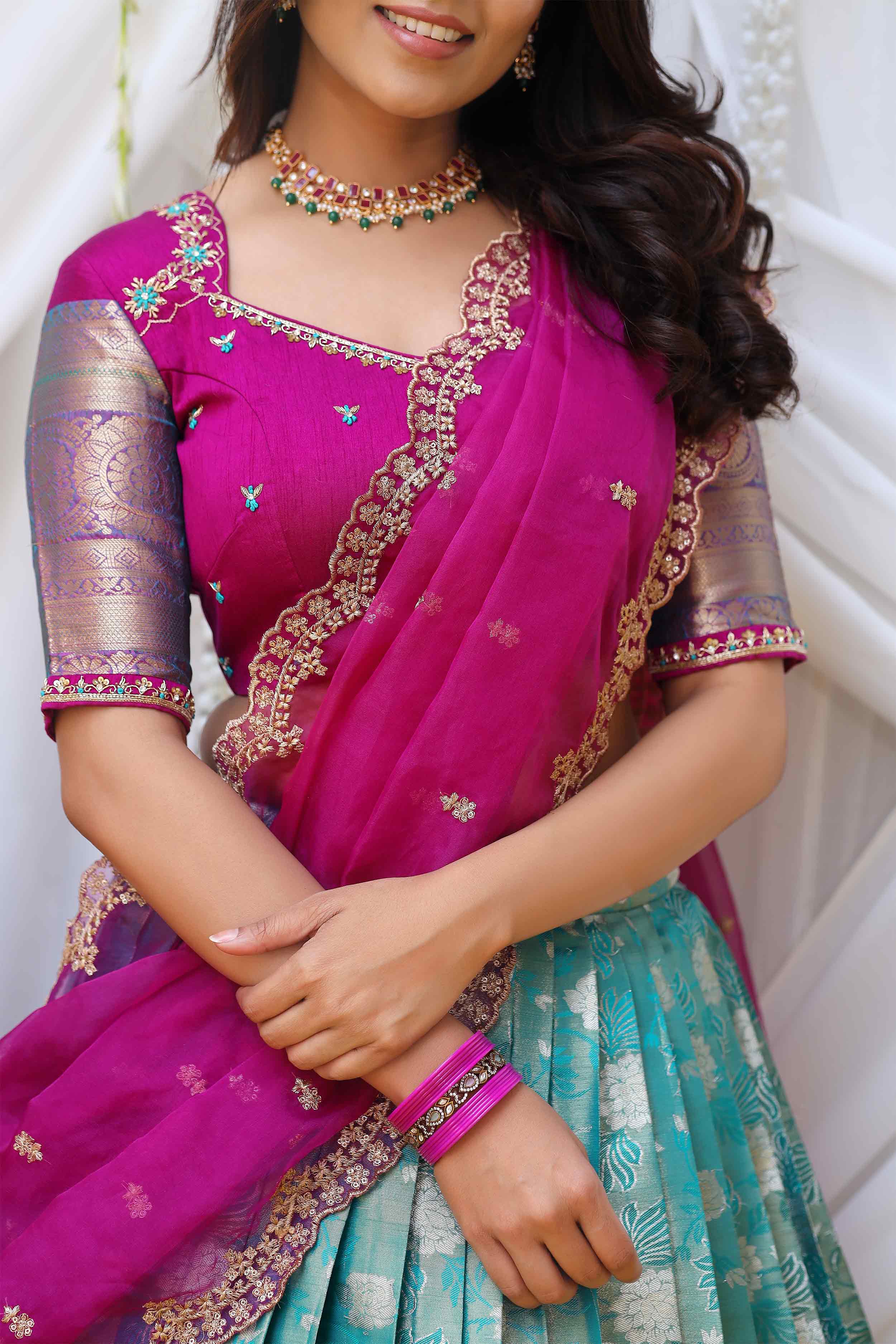 a woman in Turquoise and Magenta lahenga set