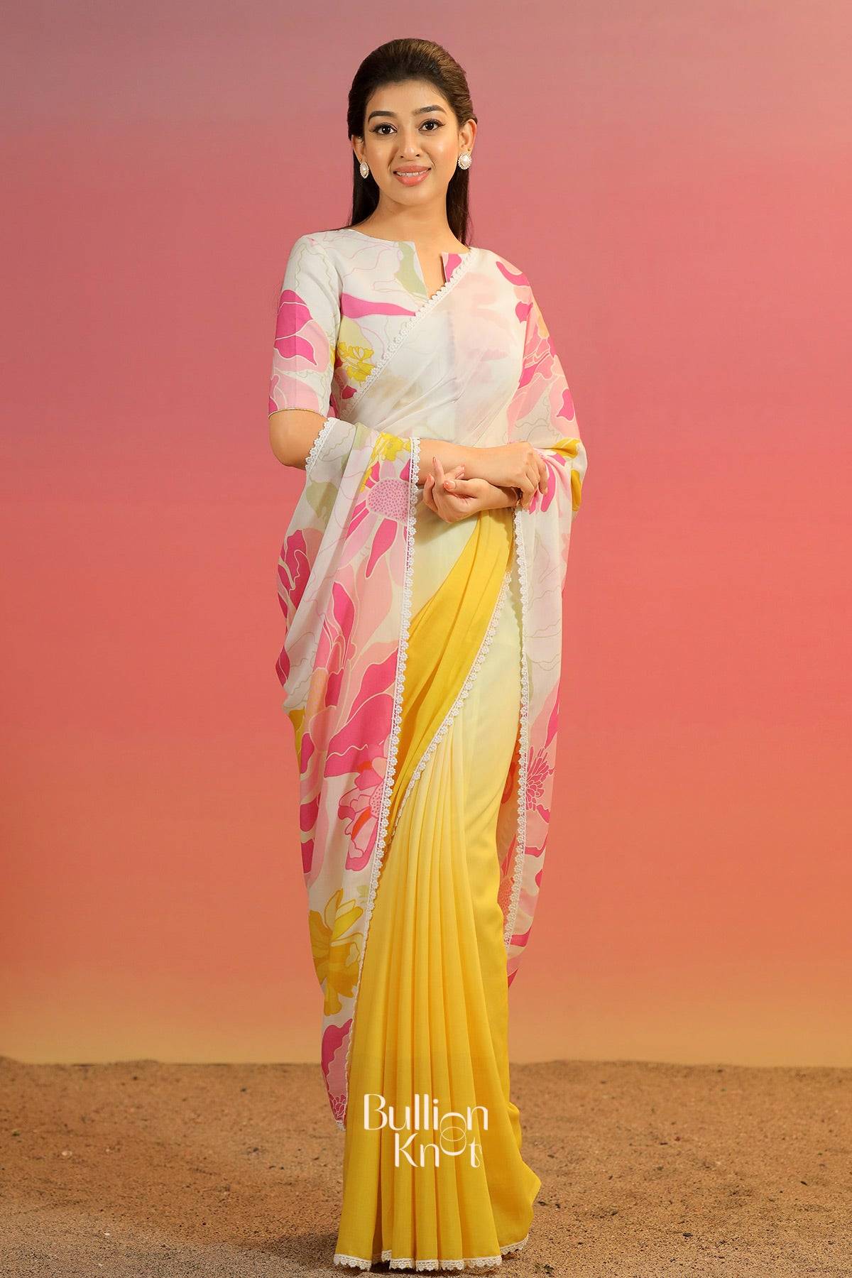 Woman wearing a yellow and pink saree 