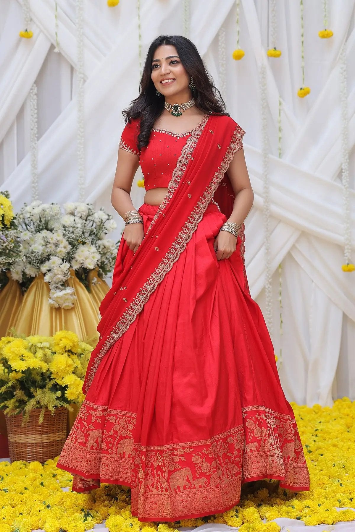 a woman in red banarasi saree