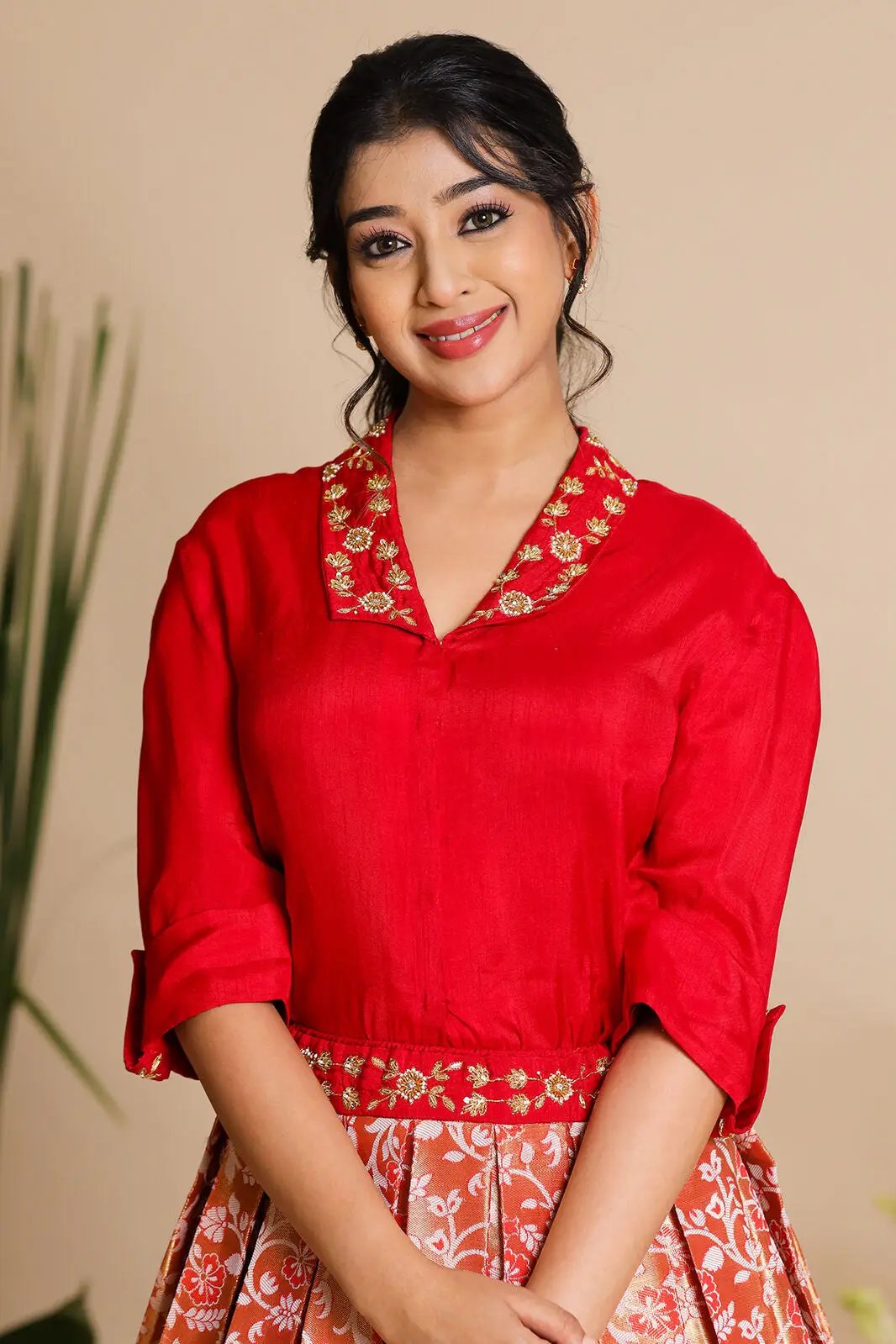 Model wearing Meera Indo Western red lehenga