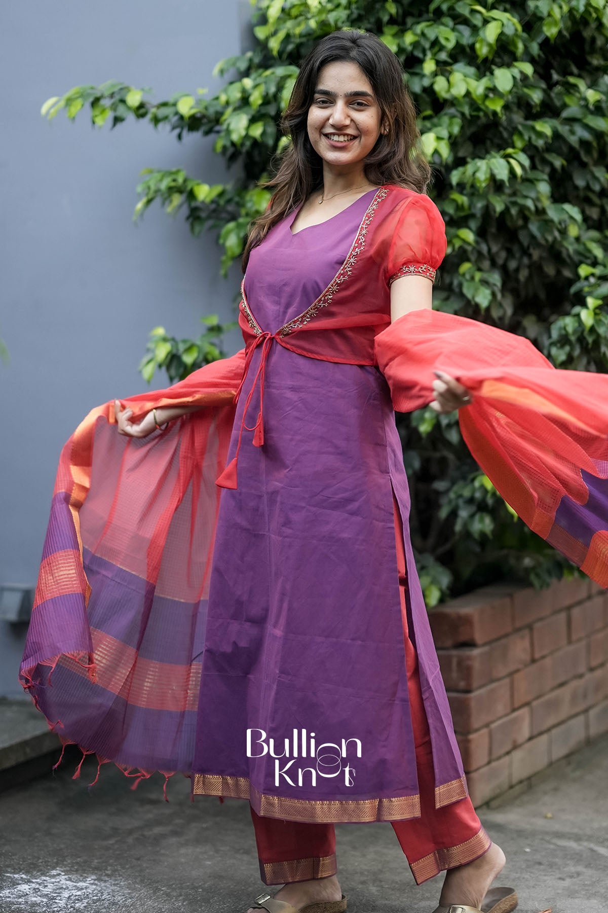 Side profile of Mrinalika Organza Jacket Suit Set highlighting fit