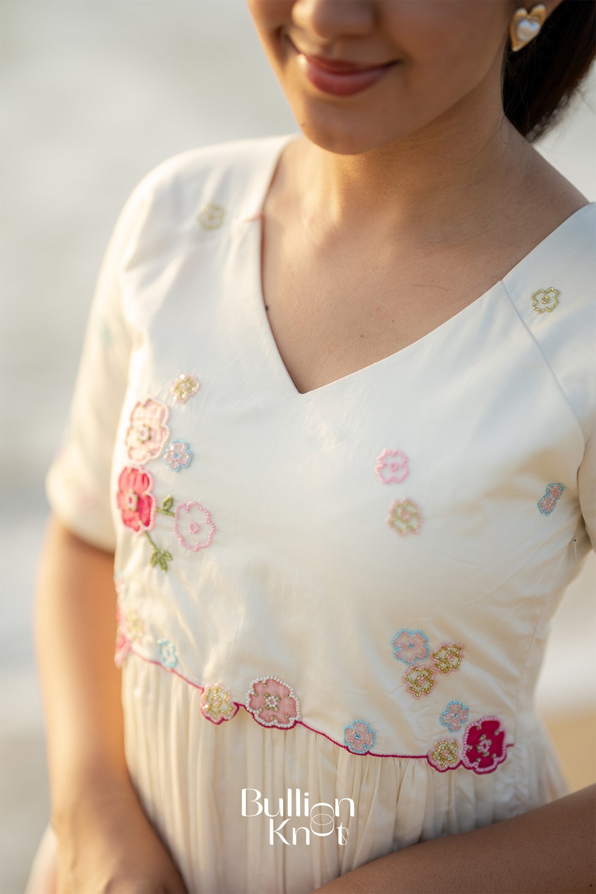 Close-up of Niaa White Midi Dress fabric detailing
