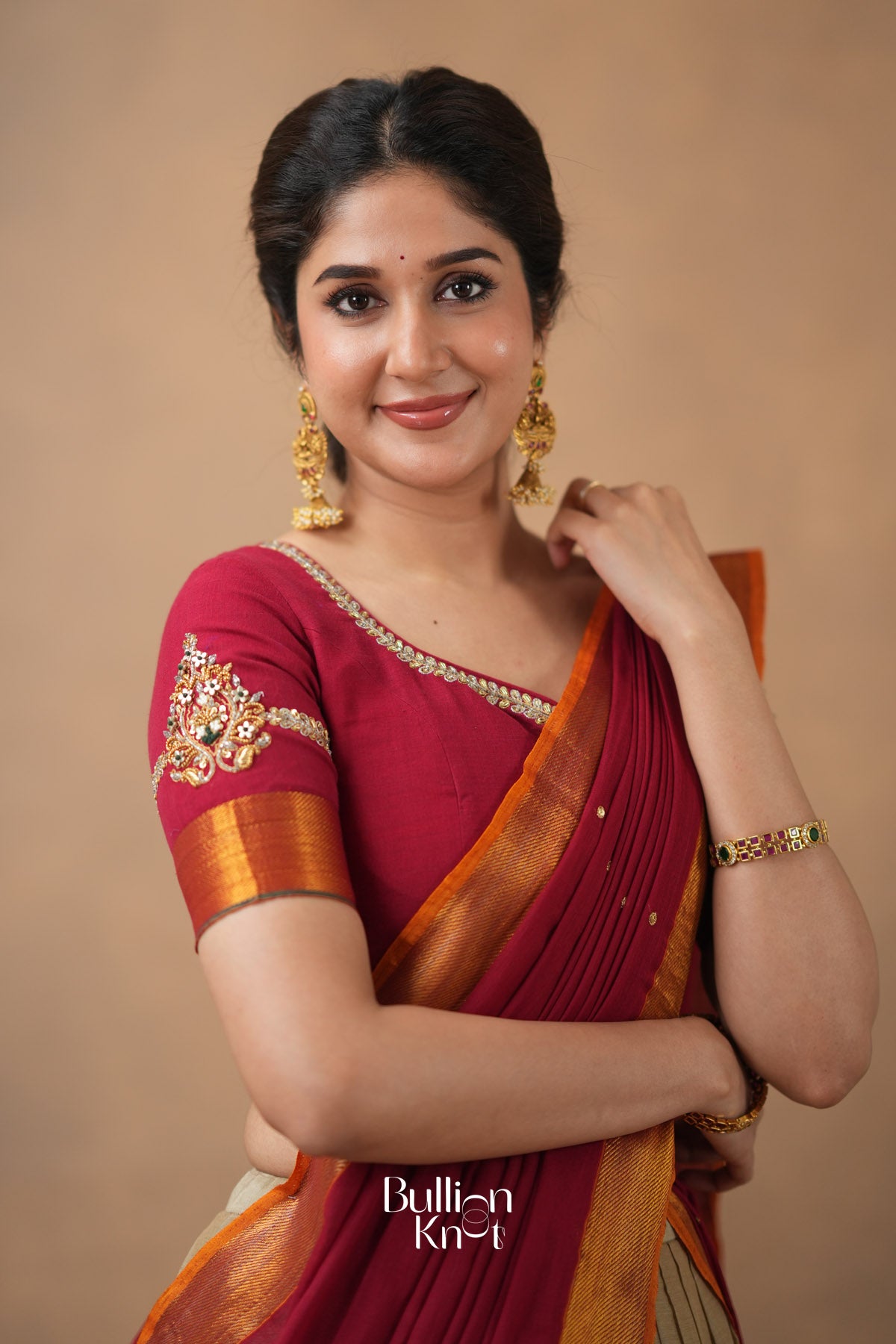 Handcrafted bridal blouse with detailed Maggam motifs