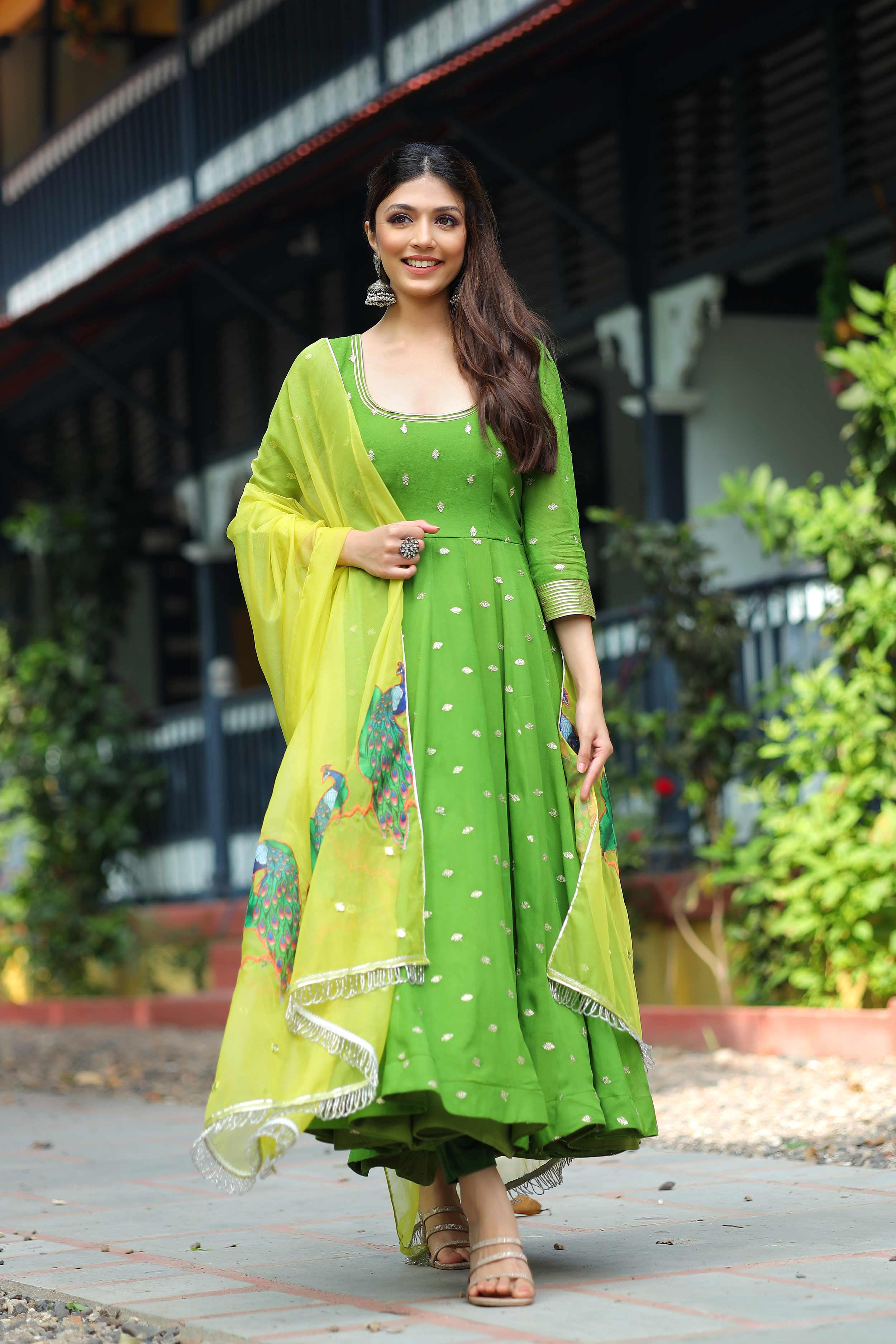 A woman in Green Anarkali Set