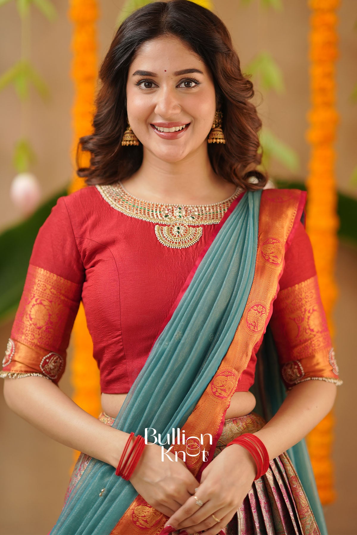 Hand-embroidered blouse detail with intricate thread and zari work.