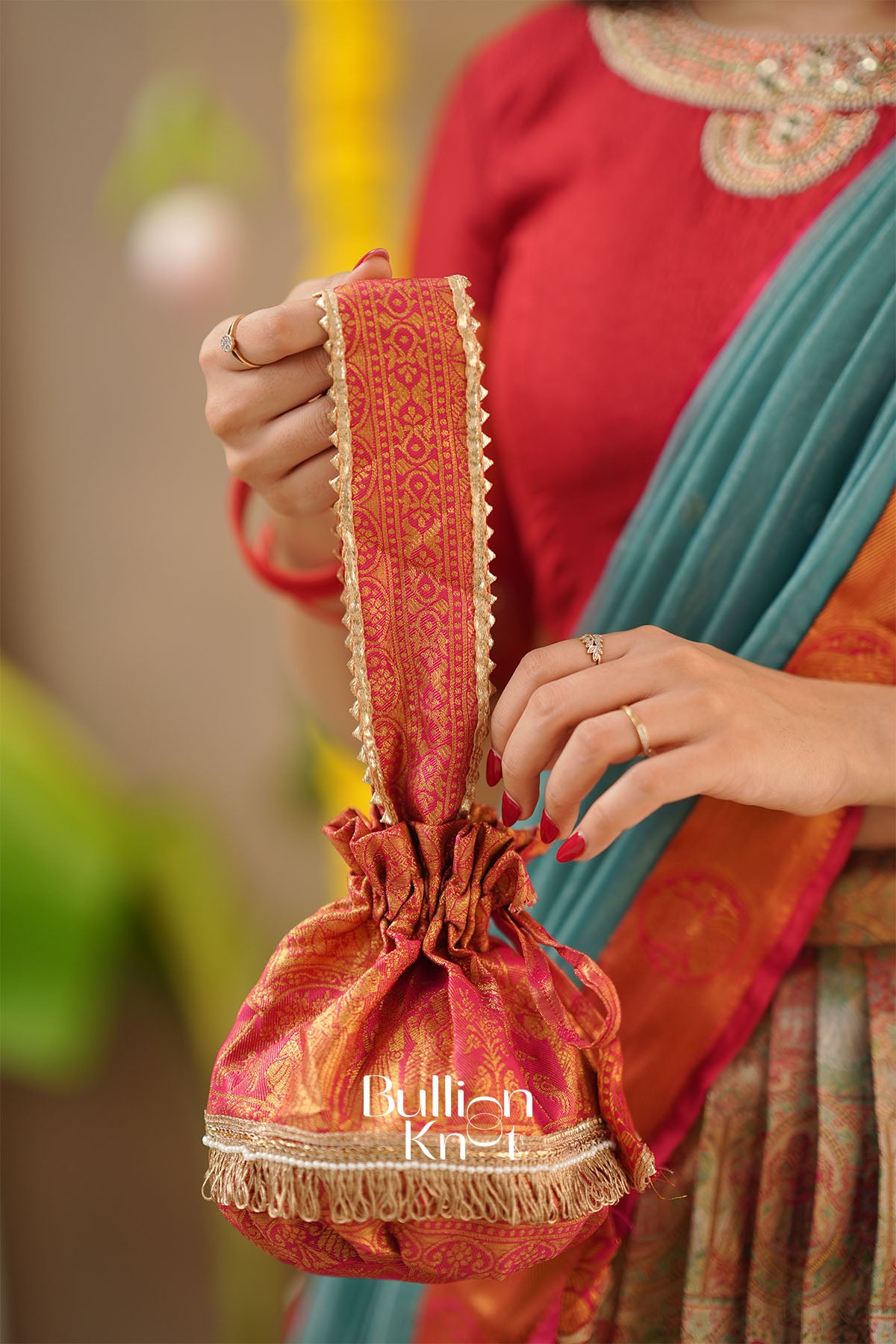 Sanskruti Red Semi-Kanjivaram Silk Lehenga Set – dupatta styling with Potli Purse.