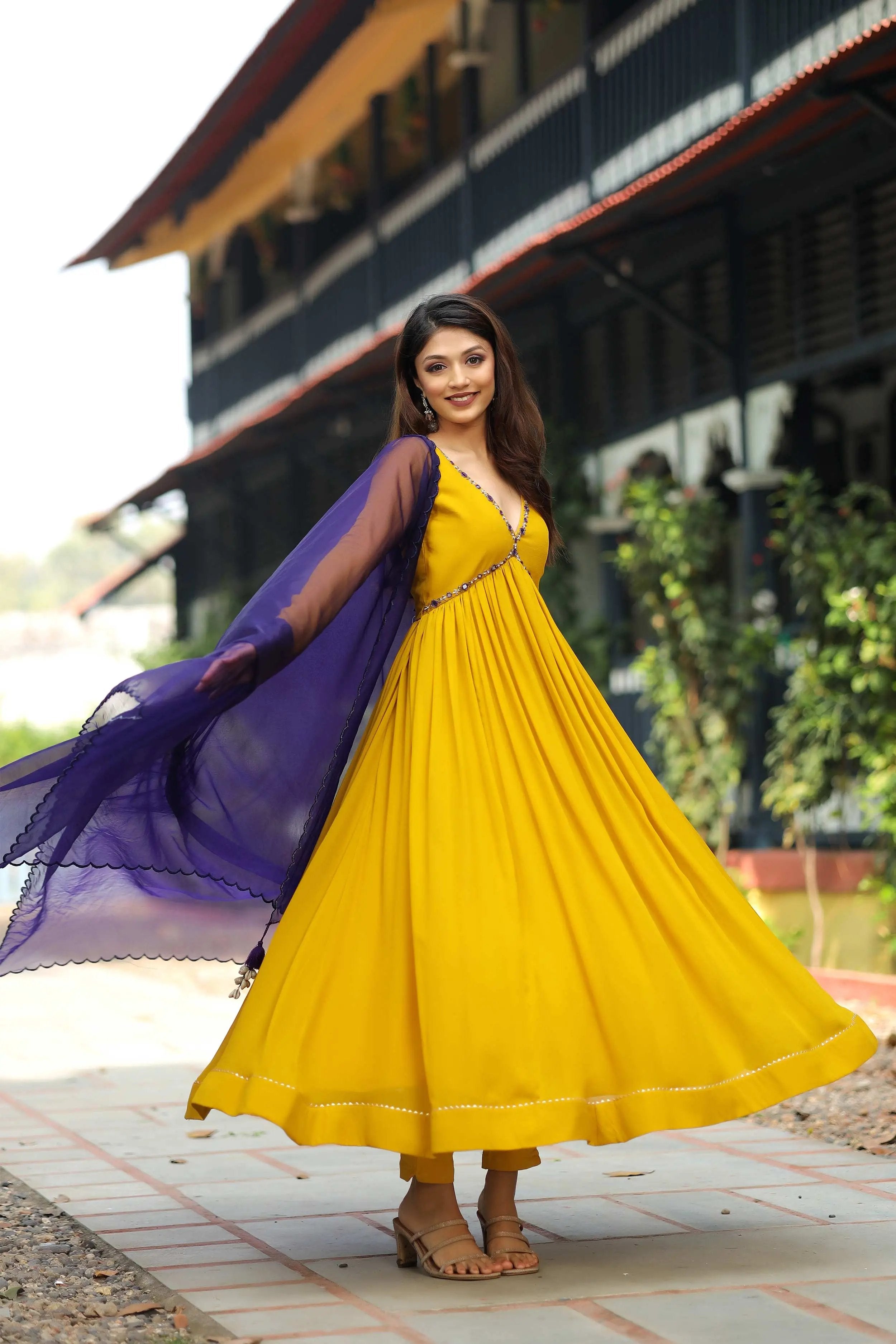 a woman in yellow Pattu Dress