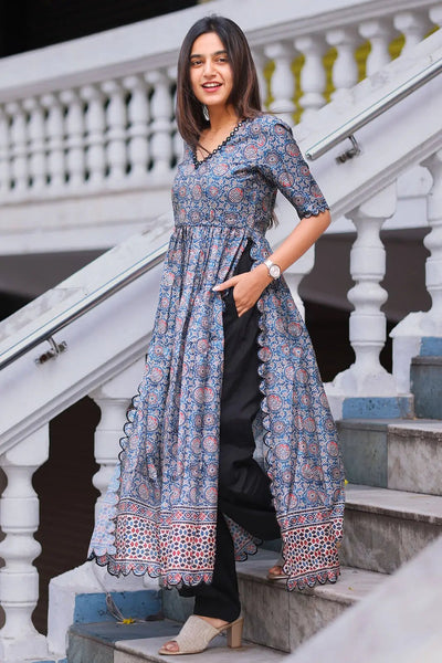 Yashna Ajarakh Kurta Set in blue, full view on stairs