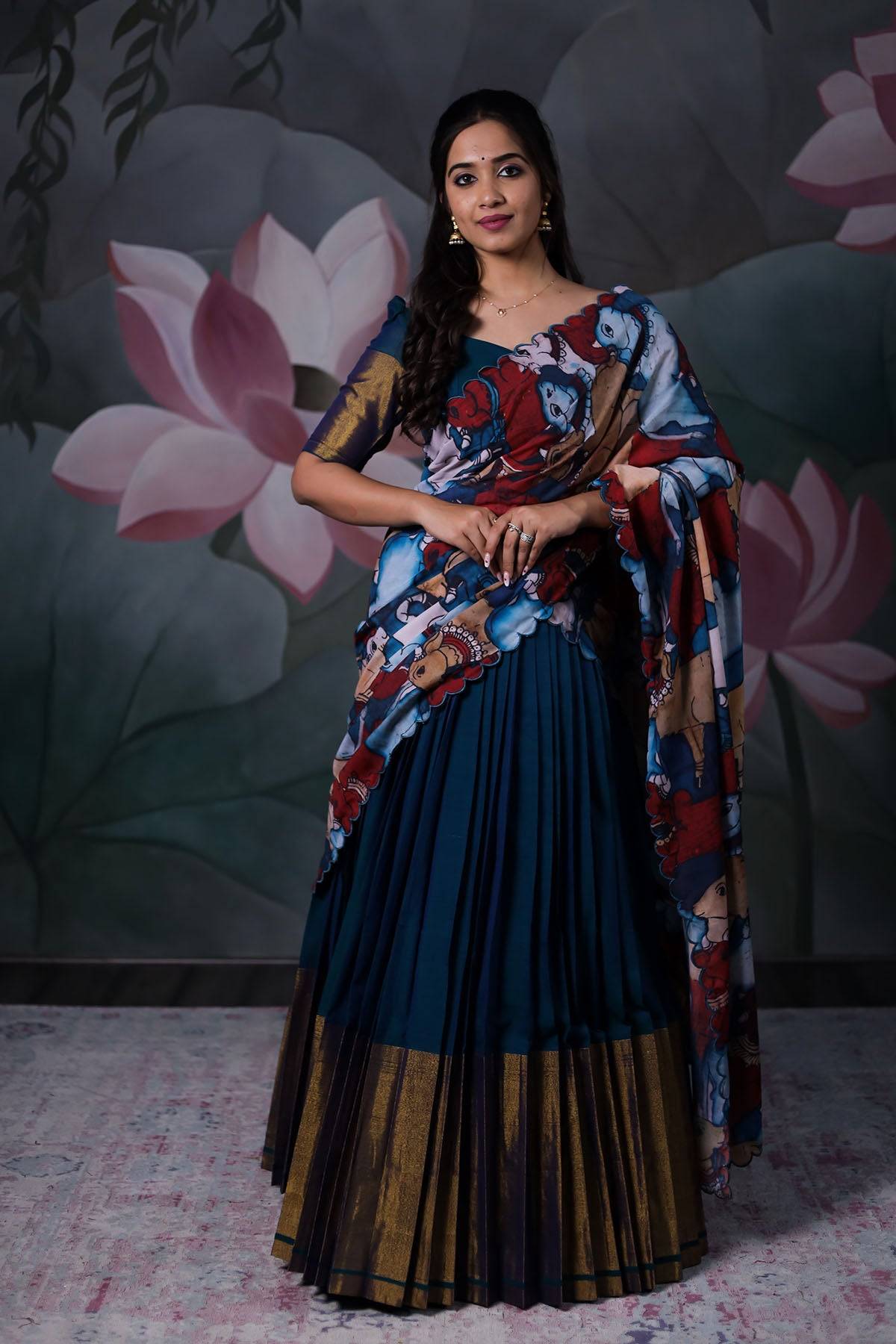 a women with dark blue Ahalya Handloom Lehenga set with cotton dupatta from Bullionknot