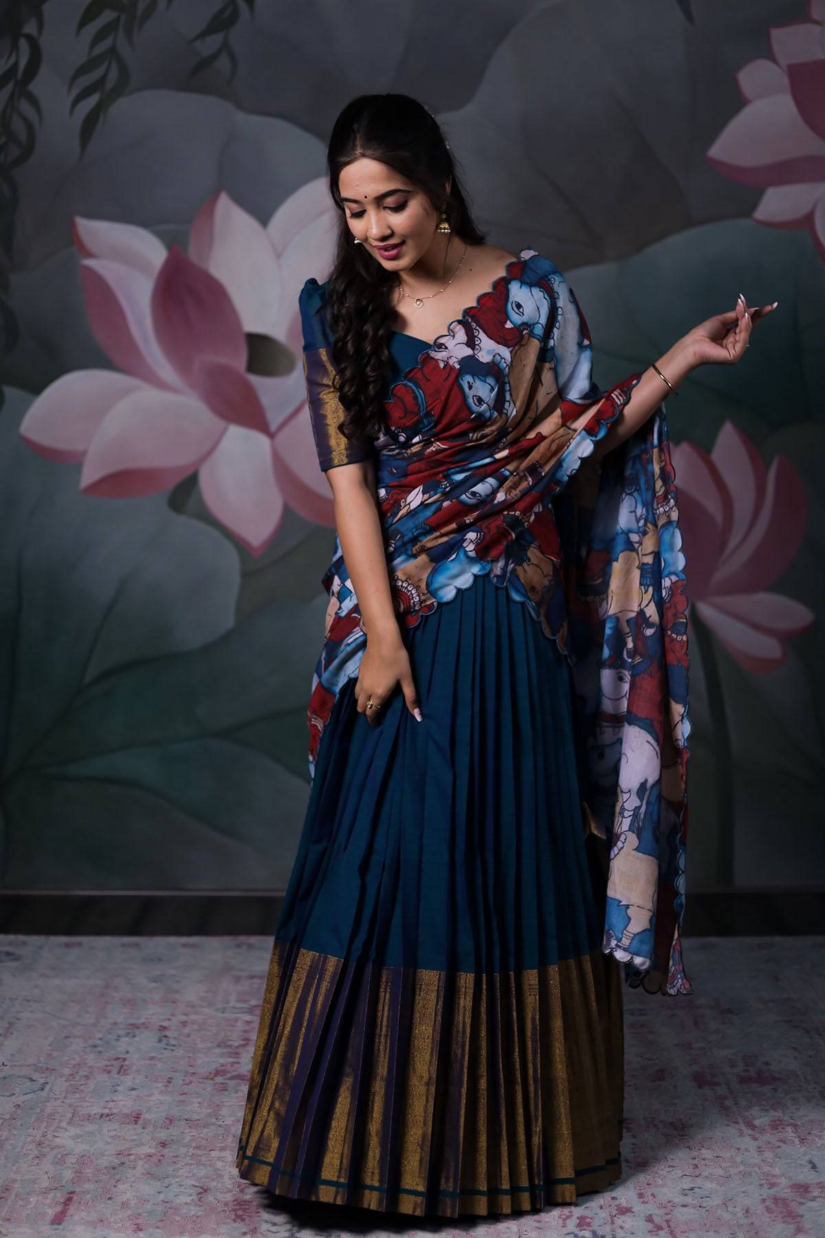 a women with dark blue Handloom Lehenga Dress with cotton dupatta from Bullionknot