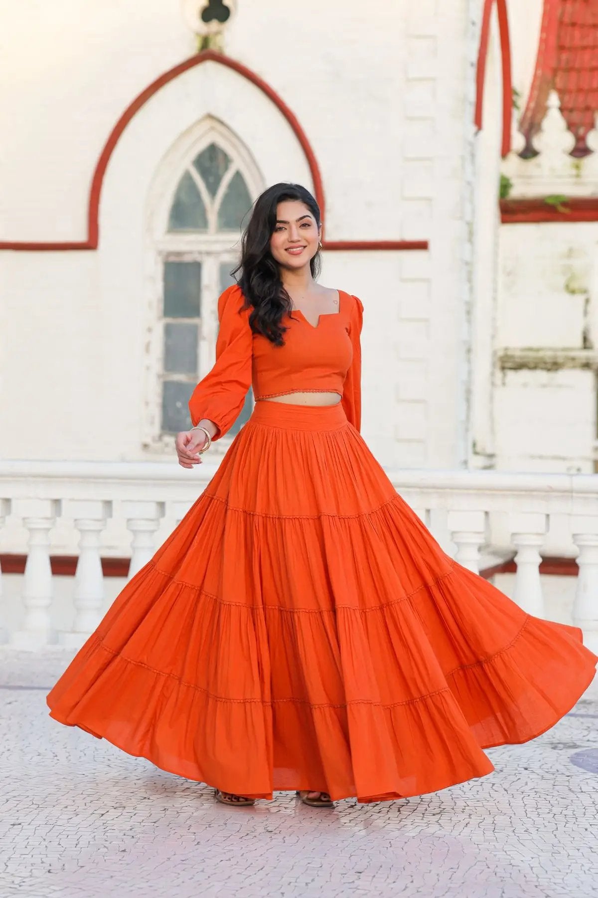 Vibrant orange lehenga with flared skirt