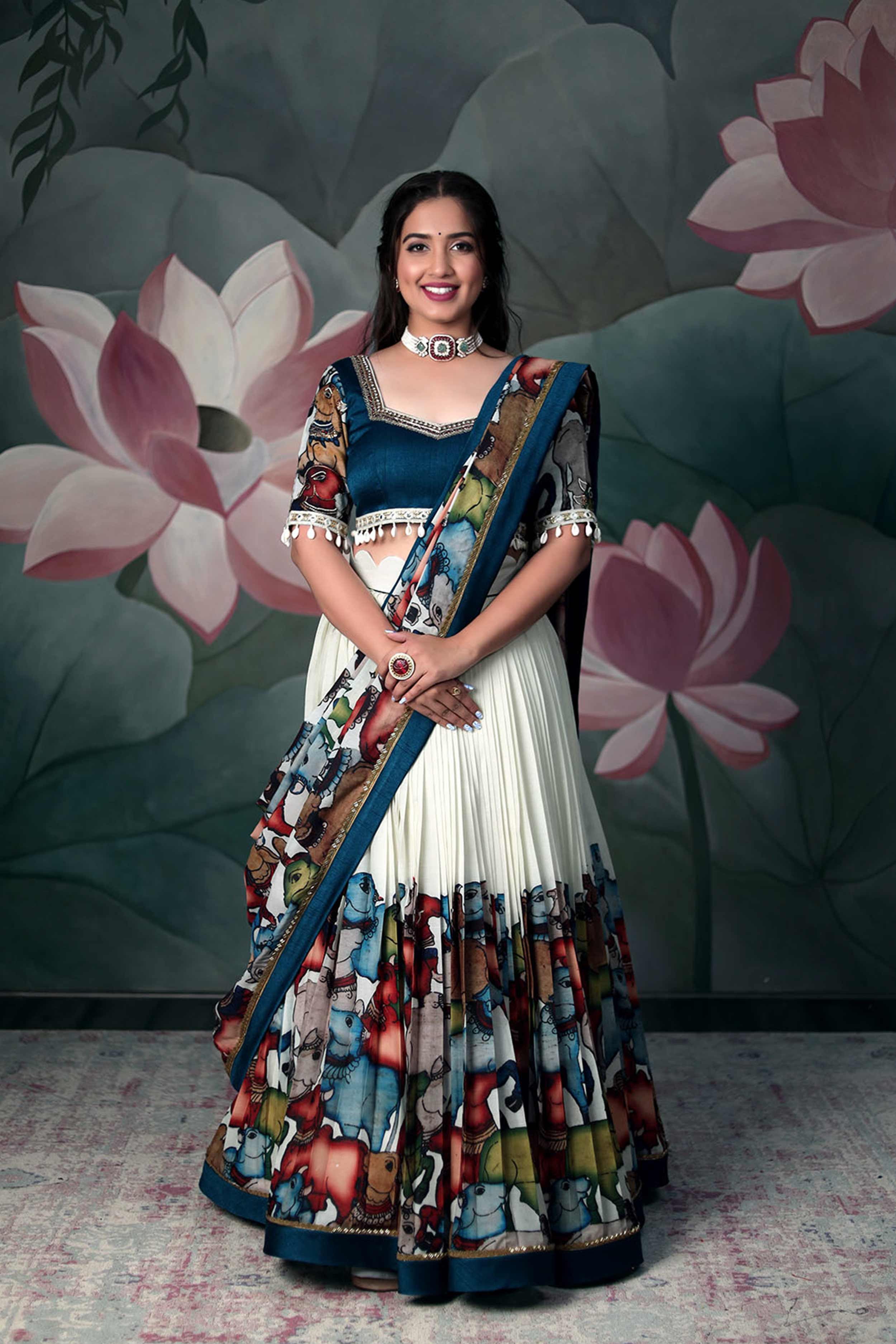 a model posing with Pen Kalamkari Handloom Design Lehenga Dress from the varieties of lehengas designs from Bullionknot