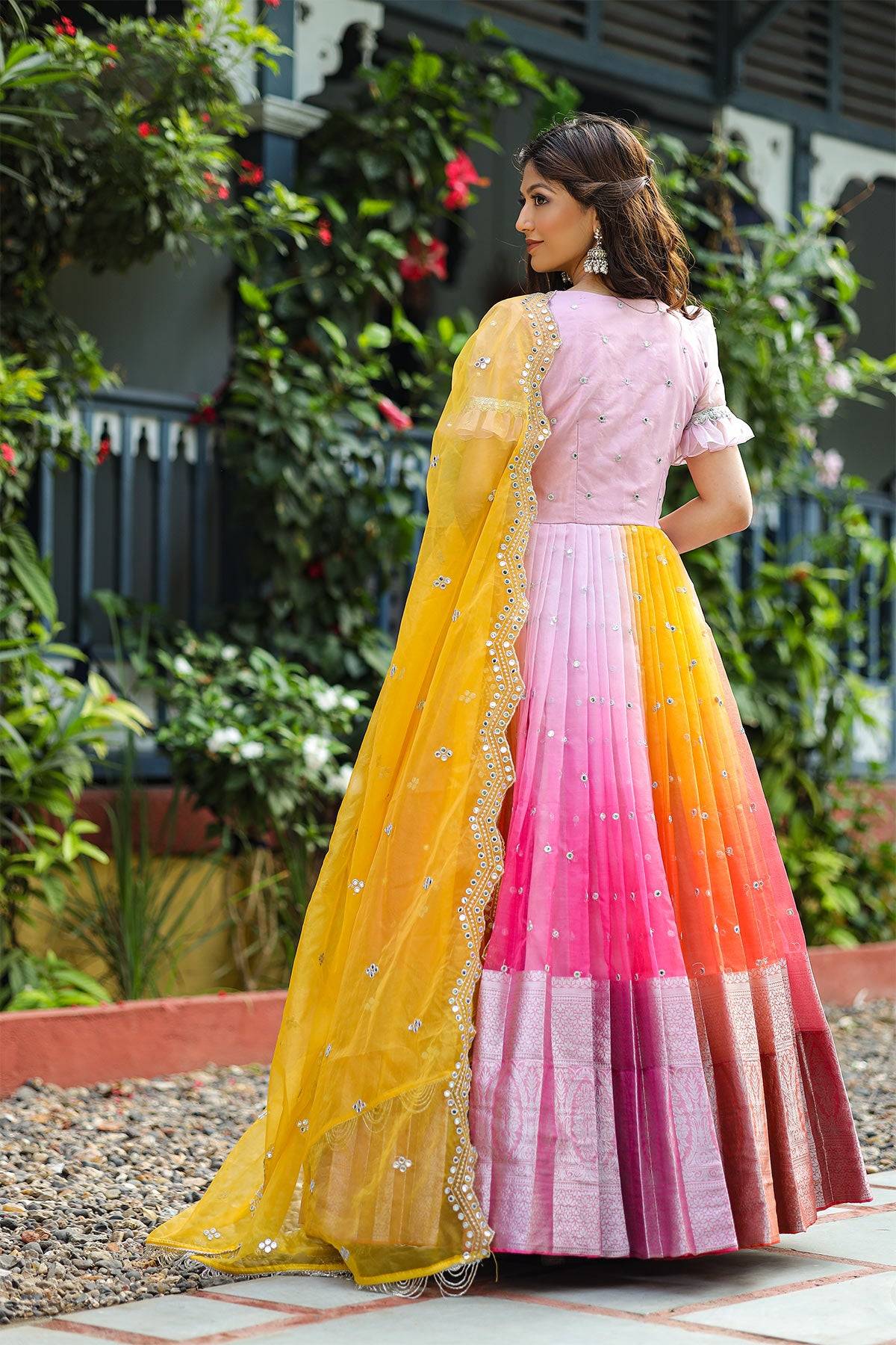 a women in pink and orange Organza Anarkali Dress with yellow dupatta